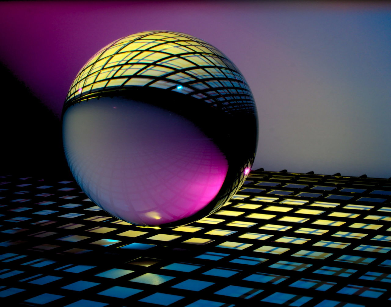 A mirrored ball on top of a grid - Destination Certification