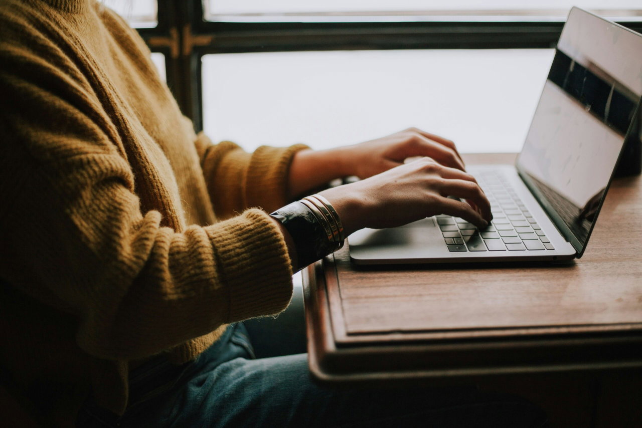 Image of a woman typing on her laptop - Destination Certification