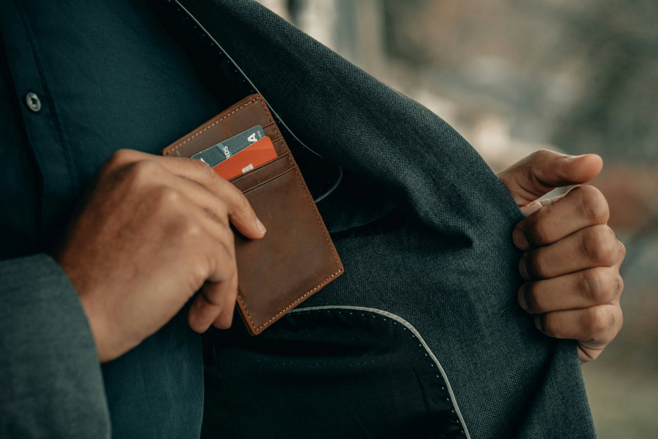 image of a man putting his wallet in his pocket - Destination Certification