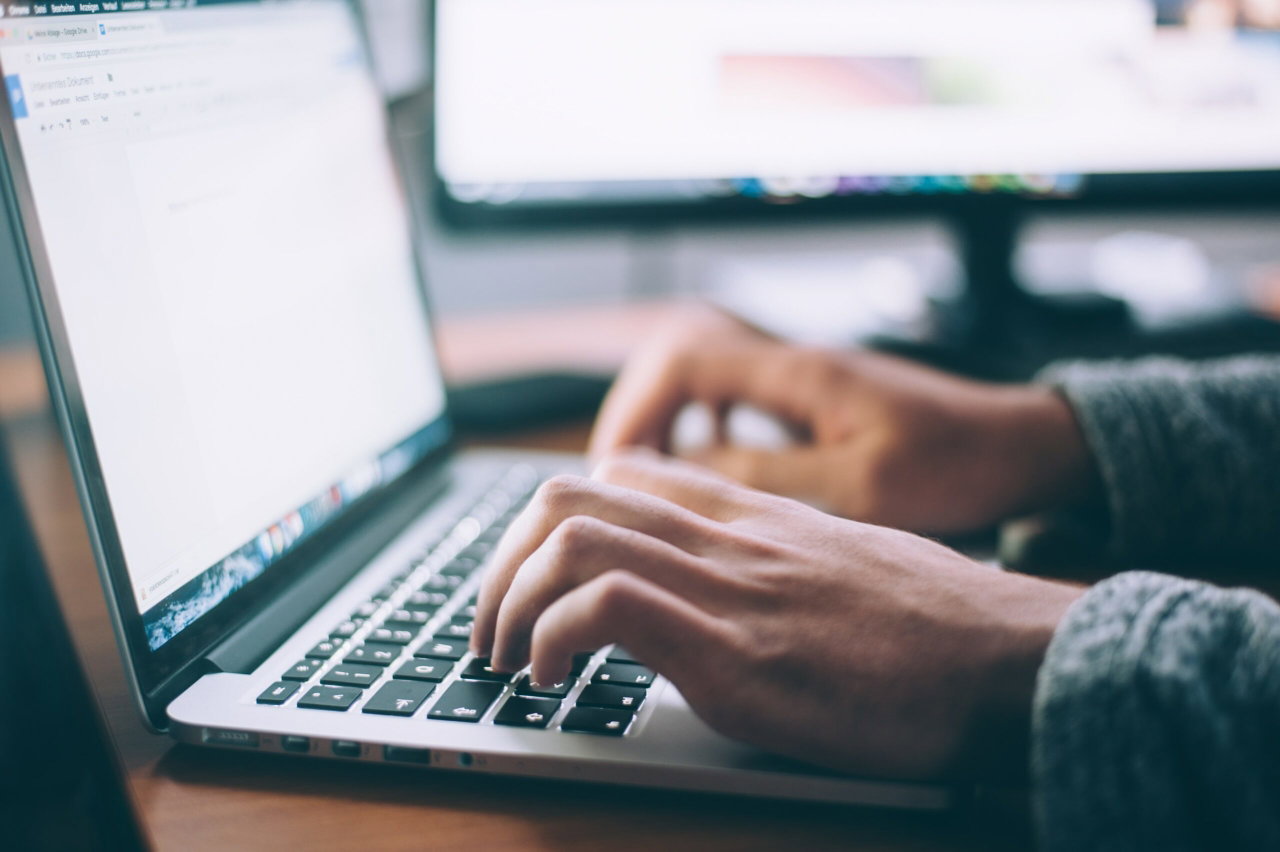 Image of a man typing on a laptop - Destination Certification